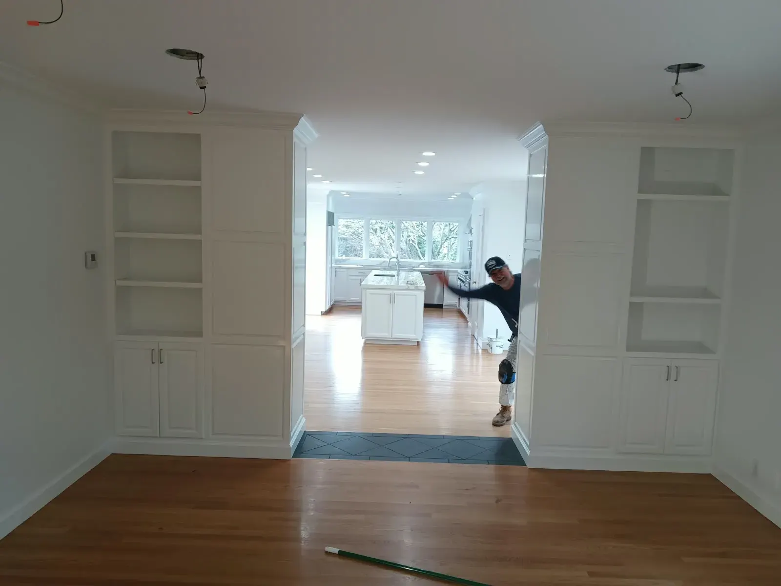 Cabinet painting in San Jose, CA: white built-in cabinets and shelving