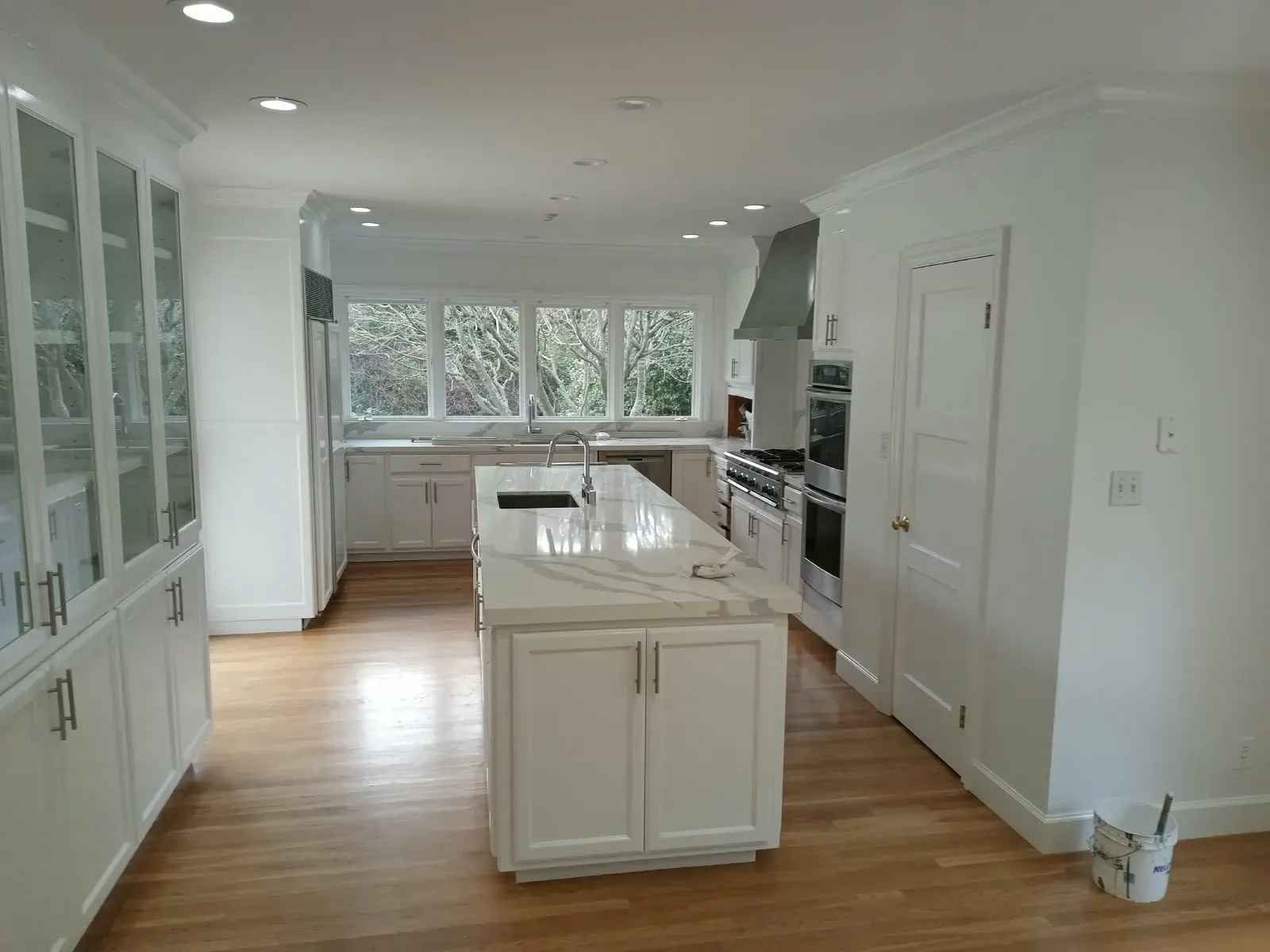 Cabinet painting and refinishing in San Jose, CA: white kitchen cabinets and island