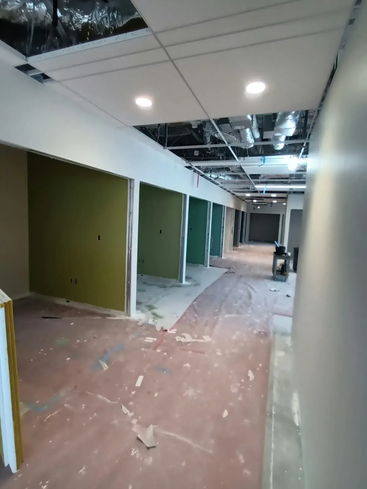 Drywall finishing in San Jose, CA: corridor with finished walls and new partitions