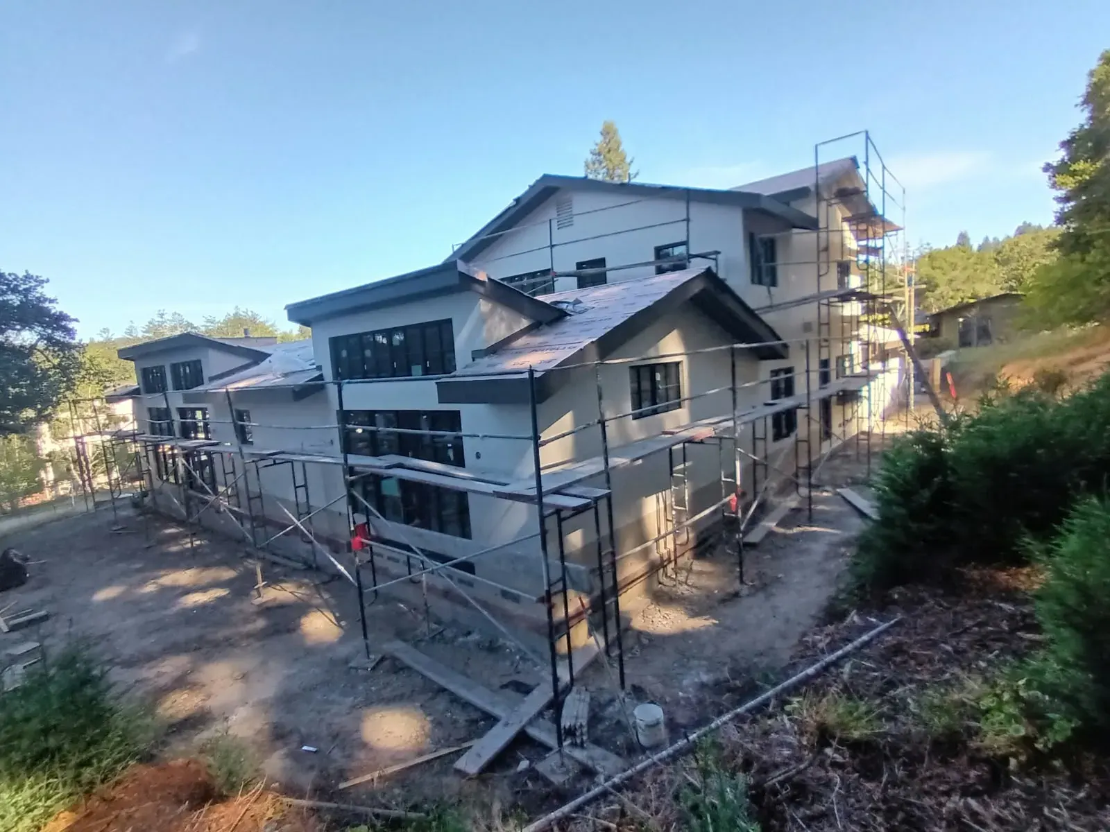 House painting in Campbell, CA: two-story home with scaffolding for exterior work