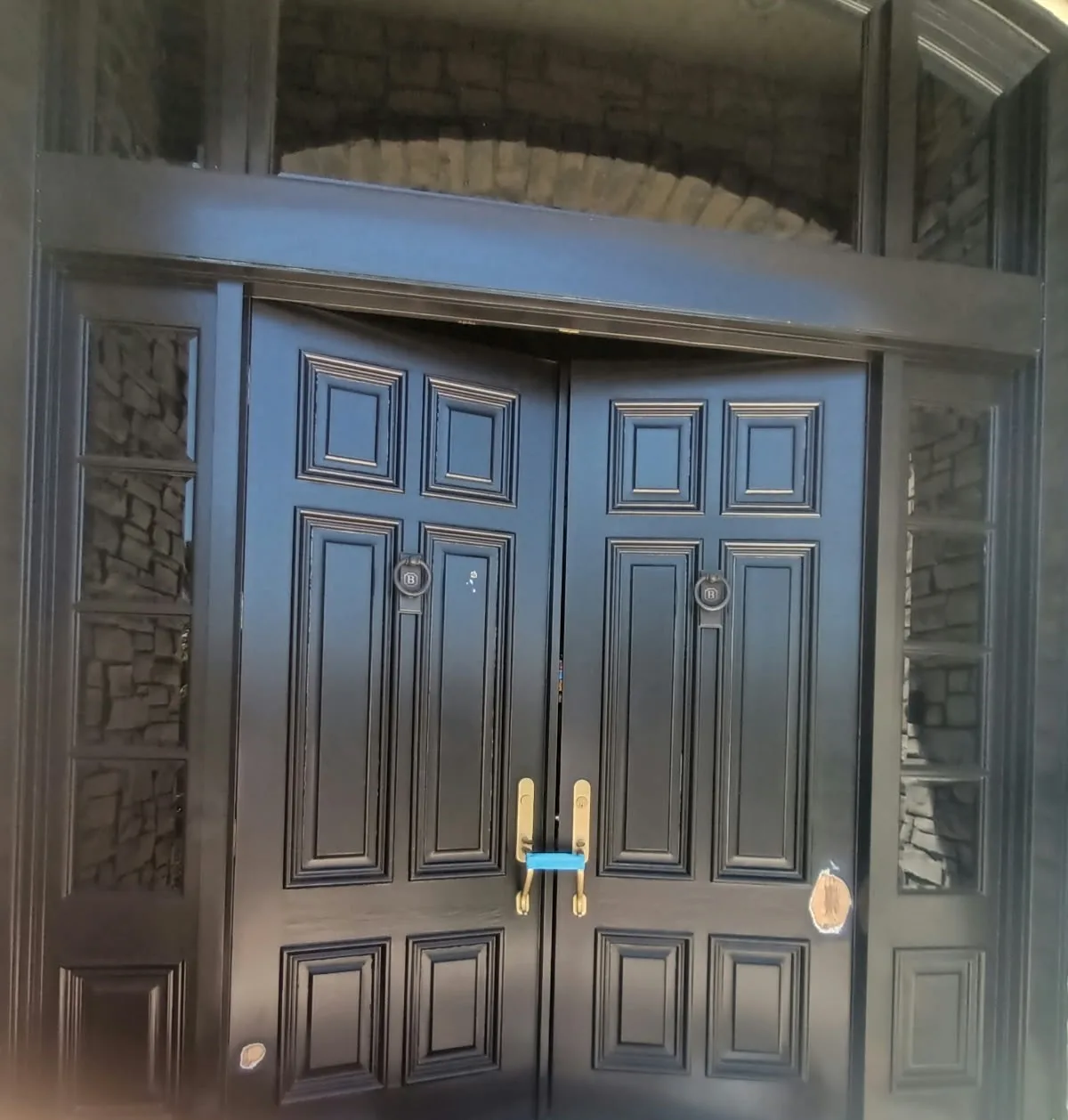 Door painting in San Jose, CA: dark double entry doors with raised panels