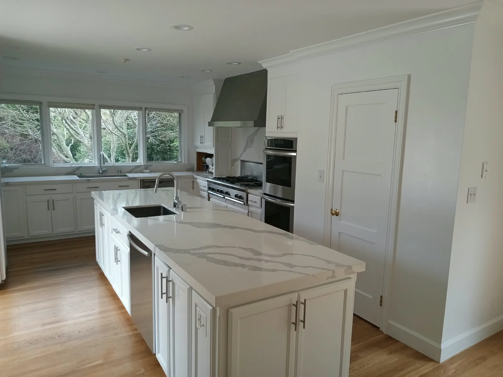 Cabinet and trim painting in San Jose, CA: white kitchen with painted cabinets and trim